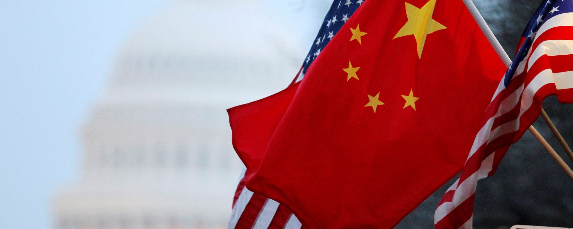 The People's Republic of China flag and the U.S. Stars and Stripes fly along Pennsylvania Avenue near the US Capitol during Chinese President Hu Jintao's state visit in Washington, DC, US on January 18, 2011. The People's Republic of China flag and the U.S. Stars and Stripes fly along Pennsylvania Avenue near the US Capitol during Chinese President Hu Jintao's state visit in Washington, DC, US on January 18, 2011. - Sputnik International, 1920, 28.08.2021