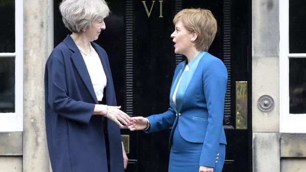 Britain's Prime Minister Theresa May (L) is greeted by Scotland's First Minister Nicola Sturgeon (R) as she arrives for talks at Bute House, in Edinburgh, on July 15, 2016. Britain's Prime Minister Theresa May (L) is greeted by Scotland's First Minister Nicola Sturgeon (R) as she arrives for talks at Bute House, in Edinburgh, on July 15, 2016. - Sputnik International