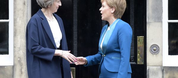 Britain's Prime Minister Theresa May (L) is greeted by Scotland's First Minister Nicola Sturgeon (R) as she arrives for talks at Bute House, in Edinburgh, on July 15, 2016. Britain's Prime Minister Theresa May (L) is greeted by Scotland's First Minister Nicola Sturgeon (R) as she arrives for talks at Bute House, in Edinburgh, on July 15, 2016. - Sputnik International