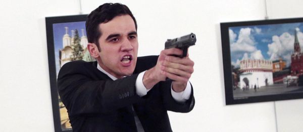 Gunman gestures after shooting the Russian Ambassador to Turkey, Andrei Karlov, at a photo gallery in Ankara, Turkey, Monday, Dec. 19, 2016 Gunman gestures after shooting the Russian Ambassador to Turkey, Andrei Karlov, at a photo gallery in Ankara, Turkey, Monday, Dec. 19, 2016 - Sputnik International