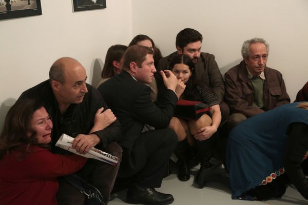 People react after the the Russian Ambassador to Turkey, Andrei Karlov, was shot at a photo gallery in Ankara, Turkey, Monday, Dec. 19, 2016 - Sputnik International