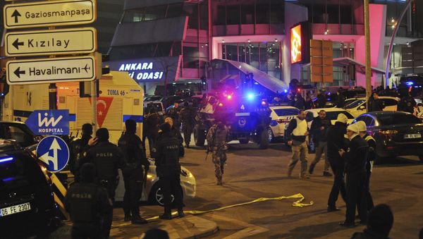Turkish police officers cordon off the area close to a photo gallery where the Russian Ambassador to Turkey, Andrei Karlov, was shot and killed by a gunman in Ankara, Turkey. - Sputnik International