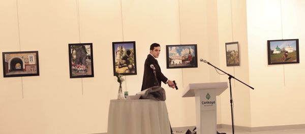Altintas gestures after shooting the Russian Ambassador to Turkey, Andrei Karlov, at a photo gallery in Ankara, Turkey. Altintas gestures after shooting the Russian Ambassador to Turkey, Andrei Karlov, at a photo gallery in Ankara, Turkey. - Sputnik International