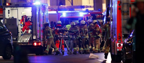 Police and emergency workers at the site of an attack at a Christmas market in Berlin. Police and emergency workers at the site of an attack at a Christmas market in Berlin. - Sputnik International