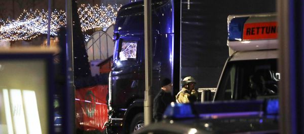 Police stand beside a damaged truck which ran into crowded Christmas market in Berlin, Germany. Police stand beside a damaged truck which ran into crowded Christmas market in Berlin, Germany. - Sputnik International