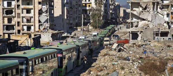 Buses are seen during an evacuation operation of rebel fighters and their families from rebel-held neighbourhoods in the embattled city of Aleppo on December 15, 2016 Buses are seen during an evacuation operation of rebel fighters and their families from rebel-held neighbourhoods in the embattled city of Aleppo on December 15, 2016 - Sputnik International