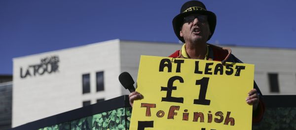 Anti-fracking (hydrolic fracturing) campaigner Gayzer Frackman is seen with a placard in Birmingham, central England, on October 2, 2016 on the first day of the Conservative party annual conference being held at Birmingham's International Convention Centre Anti-fracking (hydrolic fracturing) campaigner Gayzer Frackman is seen with a placard in Birmingham, central England, on October 2, 2016 on the first day of the Conservative party annual conference being held at Birmingham's International Convention Centre - Sputnik International