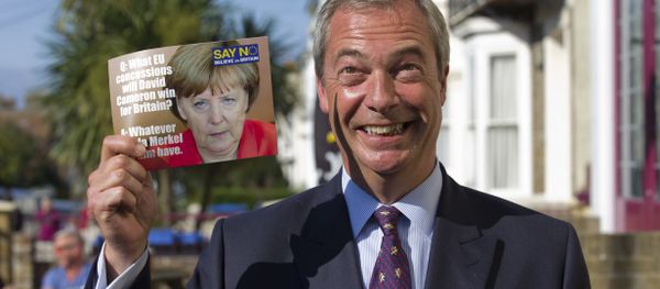 Leader of the UK Independence Party (UKIP) Nigel Farage, poses with a leaflet showing a picture of German Chancellor Angela Merkel in Cliftonville, Margate east of London, as he kicks off their Say No To The EU tour on September 7, 2015, during the party’s referendum campaign. Leader of the UK Independence Party (UKIP) Nigel Farage, poses with a leaflet showing a picture of German Chancellor Angela Merkel in Cliftonville, Margate east of London, as he kicks off their Say No To The EU tour on September 7, 2015, during the party’s referendum campaign. - Sputnik International