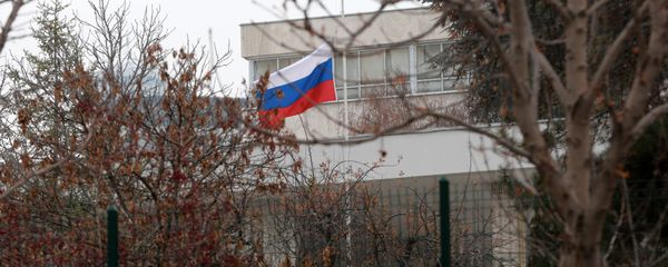 Russian flag flies at half mast in front of the Russian Embassy in Ankara on December 20, 2016, a day after the Russian Ambassador to Turkey was killed by a gunman - Sputnik International
