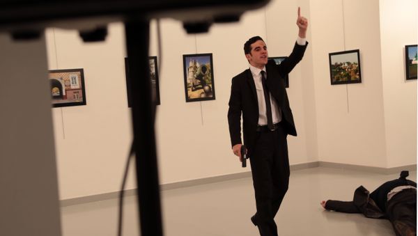A man gestures near to Andrei Karlov on ground, the Russian Ambassador to Turkey at a photo gallery in Ankara, Turkey, Monday, Dec. 19, 2016 A man gestures near to Andrei Karlov on ground, the Russian Ambassador to Turkey at a photo gallery in Ankara, Turkey, Monday, Dec. 19, 2016 - Sputnik International