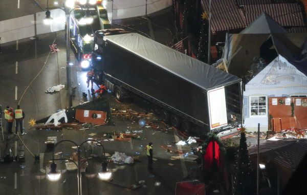A used suit of a forensic investigator lies on a Christmas tree where a truck ploughed through a crowded Christmas market killing 12 people in the west of Berlin, Germany, December 20, 2016 A used suit of a forensic investigator lies on a Christmas tree where a truck ploughed through a crowded Christmas market killing 12 people in the west of Berlin, Germany, December 20, 2016 - Sputnik International