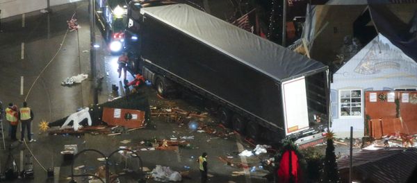 A used suit of a forensic investigator lies on a Christmas tree where a truck ploughed through a crowded Christmas market killing 12 people in the west of Berlin, Germany, December 20, 2016 A used suit of a forensic investigator lies on a Christmas tree where a truck ploughed through a crowded Christmas market killing 12 people in the west of Berlin, Germany, December 20, 2016 - Sputnik International