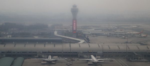 Passenger planes are on the tarmac at the Beijing Capital International Airport shrouded by pollution haze in Beijing, Thursday, Nov. 17, 2016 Passenger planes are on the tarmac at the Beijing Capital International Airport shrouded by pollution haze in Beijing, Thursday, Nov. 17, 2016 - Sputnik International