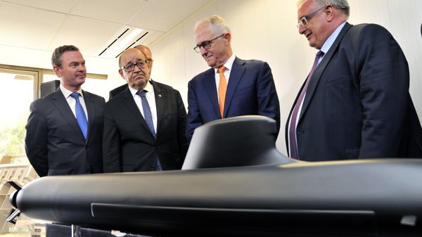 Australian Prime Minister Malcolm Turnbull, second right, stands with French Defense Minister Jean-Yves Le Drian, second left, Australian Defence Industry Minister Christopher Pyne, left, and Herve Guillou, chief executive officer of DCNS, a French state majority-owned company that will design the Shortfin Barracuda subs, as they look at a model of a submarine at the opening of the Australian headquarters of DCNS in Adelaide, Australia, Tuesday, Dec. 20, 2016 Australian Prime Minister Malcolm Turnbull, second right, stands with French Defense Minister Jean-Yves Le Drian, second left, Australian Defence Industry Minister Christopher Pyne, left, and Herve Guillou, chief executive officer of DCNS, a French state majority-owned company that will design the Shortfin Barracuda subs, as they look at a model of a submarine at the opening of the Australian headquarters of DCNS in Adelaide, Australia, Tuesday, Dec. 20, 2016 - Sputnik International