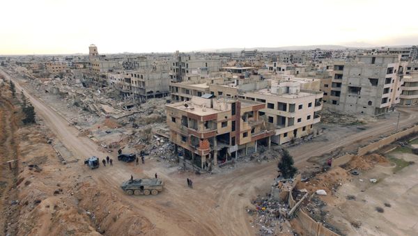Syrian army troops move through the town of Darayya, a suburb of Damascus. Syrian army troops move through the town of Darayya, a suburb of Damascus. - Sputnik International