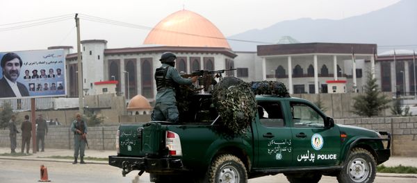 Afghan policemen stand alert in front of the new parliament building after a rocket attack in Kabul, Afghanistan (File) - Sputnik International