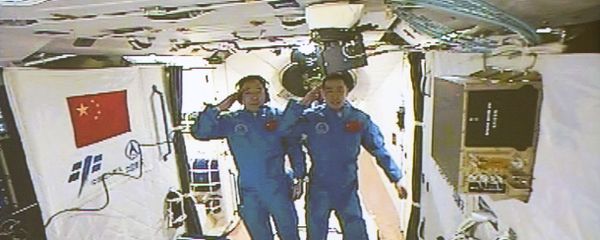 In this image taken off the screen at the Beijing Aerospace Control Center on Wednesday, Oct. 19, 2016 and released by Xinhua News Agency, two Chinese astronauts Jing Haipeng, left and Chen Dong salute in the space lab Tiangong 2 In this image taken off the screen at the Beijing Aerospace Control Center on Wednesday, Oct. 19, 2016 and released by Xinhua News Agency, two Chinese astronauts Jing Haipeng, left and Chen Dong salute in the space lab Tiangong 2 - Sputnik International