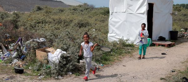 Children play in a makeshift migrant camp known as the Jungle, in Calais, northern France, Wednesday, July 29, 2015 Children play in a makeshift migrant camp known as the Jungle, in Calais, northern France, Wednesday, July 29, 2015 - Sputnik International