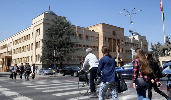 People walk across a street in front of the Parliament building in Macedonia’s capital Skopje, Thursday, April 7, 2016 People walk across a street in front of the Parliament building in Macedonia’s capital Skopje, Thursday, April 7, 2016 - Sputnik International