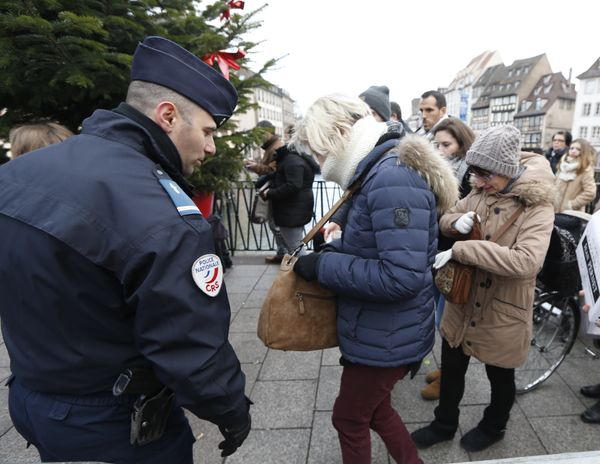 People go through security checks before entering the Christmas market in Strasbourg, eastern France, Tuesday the day after a truck ran into a crowded Christmas market and killing people Monday evening in Berlin, Germany - Sputnik International