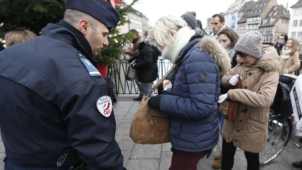 People go through security checks before entering the Christmas market in Strasbourg, eastern France, Tuesday the day after a truck ran into a crowded Christmas market and killing people Monday evening in Berlin, Germany - Sputnik International