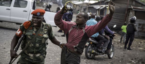 A man is arrested by a member of the military police after people attempted to block the road with rocks, in the neighbourhood of Majengo in Goma, eastern Democratic Republic of the Congo A man is arrested by a member of the military police after people attempted to block the road with rocks, in the neighbourhood of Majengo in Goma, eastern Democratic Republic of the Congo - Sputnik International