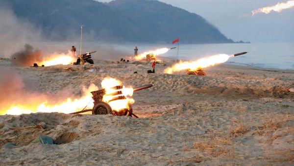 A view of a firing contest among multiple launch rocket system (MLRS) batteries selected from large combined units of the KPA, in this undated photo released by North Korea's Korean Central News Agency (KCNA) in Pyongyang - Sputnik International