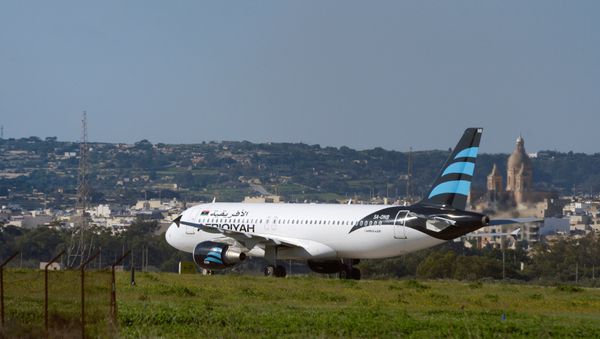 Hijacked Airbus A320 operated by Afriqiyah Airways after it landed at Luqa Airport, in Malta - Sputnik International