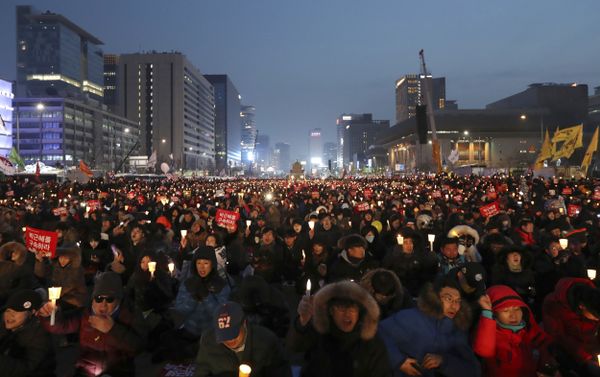 Protesters hold candles during a rally calling for South Korean President Park Geun-hye to step down in Seoul, South Korea Protesters hold candles during a rally calling for South Korean President Park Geun-hye to step down in Seoul, South Korea - Sputnik International