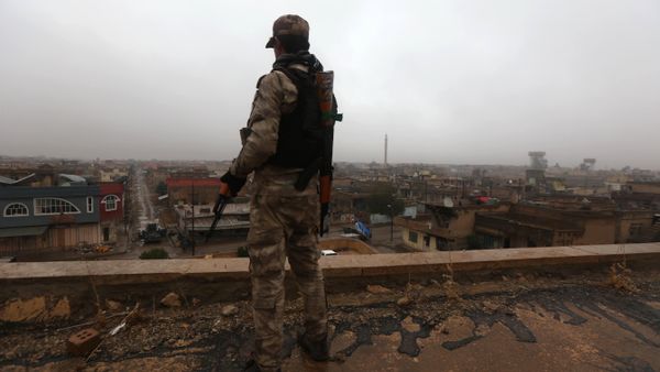 An Iraqi security member stands guard as Iraqi Christians attend a Christmas Eve service at the Saint John's church (Mar Yohanna church) in the town of Qaraqosh (also known as Hamdaniya), 30 kms east of Mosul, on December 25, 2016 An Iraqi security member stands guard as Iraqi Christians attend a Christmas Eve service at the Saint John's church (Mar Yohanna church) in the town of Qaraqosh (also known as Hamdaniya), 30 kms east of Mosul, on December 25, 2016 - Sputnik International