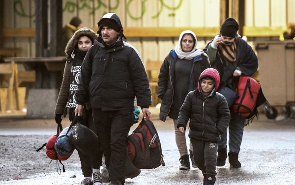 Migrants walk in a refugee camp in Grande-Synthe, northern France. (File) Migrants walk in a refugee camp in Grande-Synthe, northern France. (File) - Sputnik International