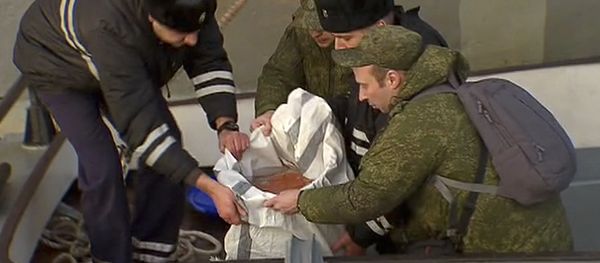In this Tuesday, Dec. 27, 2016 frame grab made available by Russian Rossiya One TV Channel Emergency Ministry soldiers pack a flight recorder of the crashed plane, on a pier just outside Sochi, Russia In this Tuesday, Dec. 27, 2016 frame grab made available by Russian Rossiya One TV Channel Emergency Ministry soldiers pack a flight recorder of the crashed plane, on a pier just outside Sochi, Russia - Sputnik International