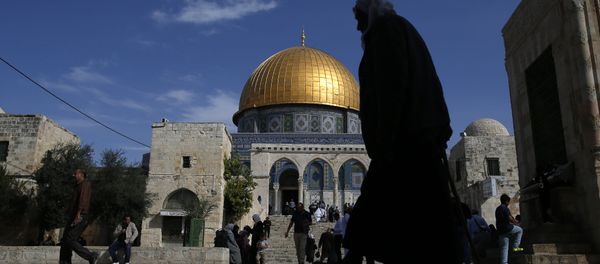 A Palestinian man walks past the Dome of Rock at the Al-Aqsa Mosque compound after the Friday prayer in Jerusalem's Old City on November 11, 2016 - Sputnik International