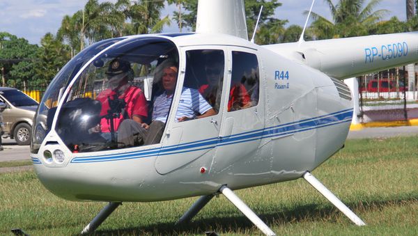 Then-local mayor of Davao city Rodrigo Duterte (R), aboard a helicopter, arrives at the provincial capitol in Tagum city, Davao del Norte, southern Philippines for the Regional Peace and Order Council meeting, April 20, 2015 Then-local mayor of Davao city Rodrigo Duterte (R), aboard a helicopter, arrives at the provincial capitol in Tagum city, Davao del Norte, southern Philippines for the Regional Peace and Order Council meeting, April 20, 2015 - Sputnik International