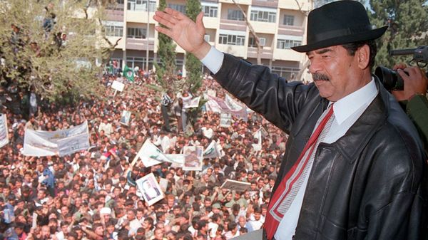 A photo released by Iraqi Press Agency 02 April shows President Saddam Hussein waving to supporters during his visit to the town of Kirkuk north of Baghdad.   - Sputnik International