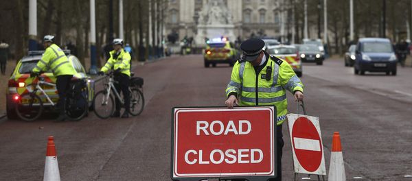 Police close a road during the Changing of the Guard ceremony at Buckingham Palace in London Police close a road during the Changing of the Guard ceremony at Buckingham Palace in London - Sputnik International