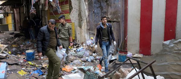Iraqi security forces gather at the site of a bomb attack at a market in central Baghdad, Iraq December 31, 2016 Iraqi security forces gather at the site of a bomb attack at a market in central Baghdad, Iraq December 31, 2016 - Sputnik International