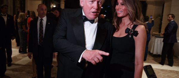 Melania Trump, right, looks on as her husband President-elect Donald Trump talks to reporters during a New Year's Eve party at Mar-a-Lago, Saturday, Dec. 31, 2016, in Palm Beach, Fla. Melania Trump, right, looks on as her husband President-elect Donald Trump talks to reporters during a New Year's Eve party at Mar-a-Lago, Saturday, Dec. 31, 2016, in Palm Beach, Fla. - Sputnik International