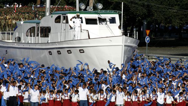 Cuban children march next to a replica of the Granma boat during a military parade along the Revolution Square in Havana,Cuba,Saturday,Dec.2,2006. Cuban children march next to a replica of the Granma boat during a military parade along the Revolution Square in Havana,Cuba,Saturday,Dec.2,2006. - Sputnik International