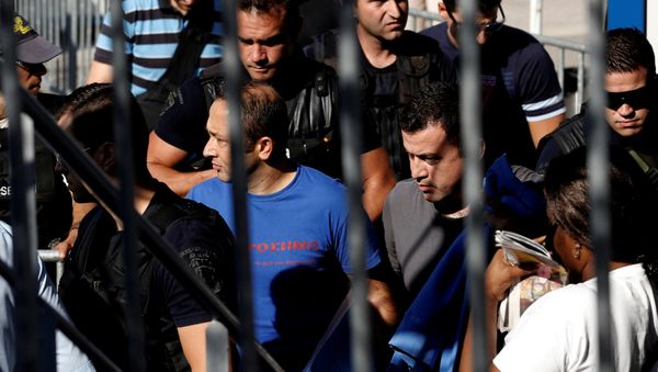Two of the eight Turkish soldiers, who fled to Greece in a helicopter and requested political asylum after a failed military coup against the government, are escorted by special police forces after the postponement of their interviews for asylum request at the Asylum Service in Athens, Greece, July 27, 2016 Two of the eight Turkish soldiers, who fled to Greece in a helicopter and requested political asylum after a failed military coup against the government, are escorted by special police forces after the postponement of their interviews for asylum request at the Asylum Service in Athens, Greece, July 27, 2016 - Sputnik International