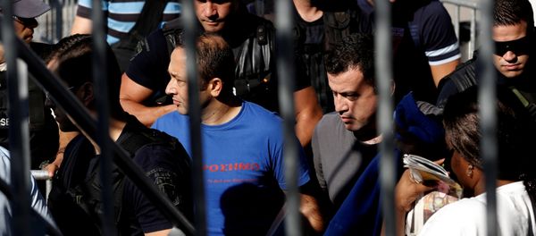 Two of the eight Turkish soldiers, who fled to Greece in a helicopter and requested political asylum after a failed military coup against the government, are escorted by special police forces after the postponement of their interviews for asylum request at the Asylum Service in Athens, Greece, July 27, 2016 - Sputnik International