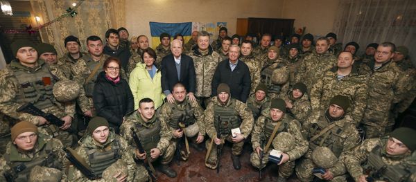 Ukrainian President Petro Poroshenko centre, Chairman of Senate Armed Services Committee, US Senator John McCain, centre left, US Senator Lindsey Graham, centre right, and US Senator Amy Klobuchar pose for photo with the Ukrainian marines, during their working trip to the Donetsk region to congratulate Ukrainian servicemen on the upcoming New Year, in the village Shyrokine, eastern Ukraine, Saturday, Dec. 31, 2016 Ukrainian President Petro Poroshenko centre, Chairman of Senate Armed Services Committee, US Senator John McCain, centre left, US Senator Lindsey Graham, centre right, and US Senator Amy Klobuchar pose for photo with the Ukrainian marines, during their working trip to the Donetsk region to congratulate Ukrainian servicemen on the upcoming New Year, in the village Shyrokine, eastern Ukraine, Saturday, Dec. 31, 2016 - Sputnik International