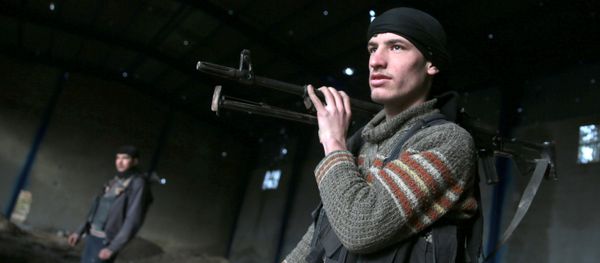 A rebel fighter carries his weapon inside a damaged building on the forth day of the truce, on al-Rayhan village front near the rebel held besieged city of Douma, in the eastern Damascus suburb of Ghouta, Syria January 2, 2017 A rebel fighter carries his weapon inside a damaged building on the forth day of the truce, on al-Rayhan village front near the rebel held besieged city of Douma, in the eastern Damascus suburb of Ghouta, Syria January 2, 2017 - Sputnik International