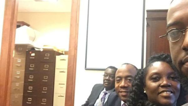 Benard Simelton (L), president of the Alabama NAACP State Conference, Cornell William Brooks (2nd L), president & CEO of the National Association for the Advancement of Colored People (NAACP), and Devon Crawford (R), a fellow with with the NAACP Youth & College Division, occupy the office of Jeff Sessions, U.S. President-elect Donald Trump's pick for for attorney general, in Mobile, Alabama, January 3, 2017 - Sputnik International