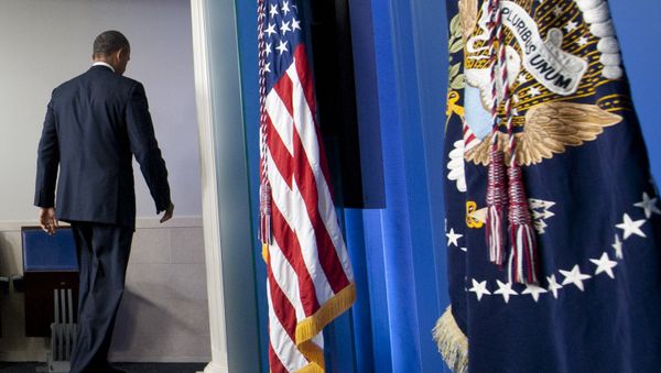 US President Barack Obama leaves after speaking about the possible government shutdown during a budget showdown with Congress in the Brady Press Briefing Room of the White House in Washington, DC, September 30, 2013 - Sputnik International