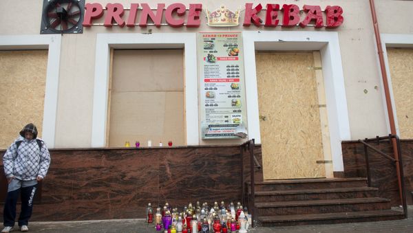 A man stands in front of the kebab shop where a 21-year old man was stabbed to death during new year's eve in a brawl with shop workers, in Elk, Poland January 2, 2017 A man stands in front of the kebab shop where a 21-year old man was stabbed to death during new year's eve in a brawl with shop workers, in Elk, Poland January 2, 2017 - Sputnik International