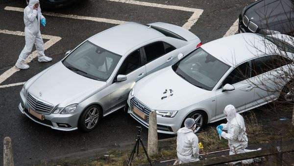 British police forensics officers inspect the scene of an incident, which resulted in a West Yorkshire police officer shooting a suspect in an Audi car, at the Ainley Top junction of the M62 motorway. - Sputnik International