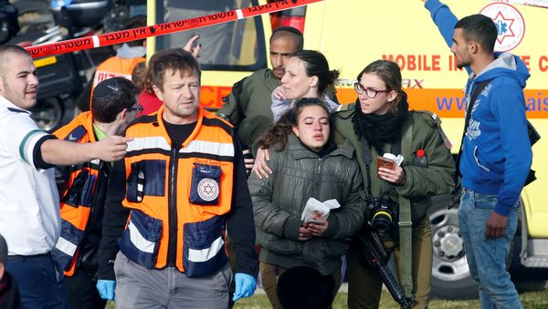 An Israeli soldier escorts another at the scene of a truck ramming incident in Jerusalem An Israeli soldier escorts another at the scene of a truck ramming incident in Jerusalem - Sputnik International