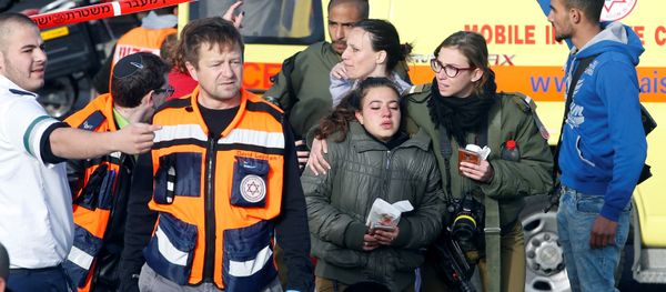 An Israeli soldier escorts another at the scene of a truck ramming incident in Jerusalem - Sputnik International