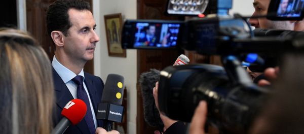 Syria's President Bashar al-Assad speaks to French journalists in Damascus, Syria, in this handout picture provided by SANA on January 9, 2017 Syria's President Bashar al-Assad speaks to French journalists in Damascus, Syria, in this handout picture provided by SANA on January 9, 2017 - Sputnik International
